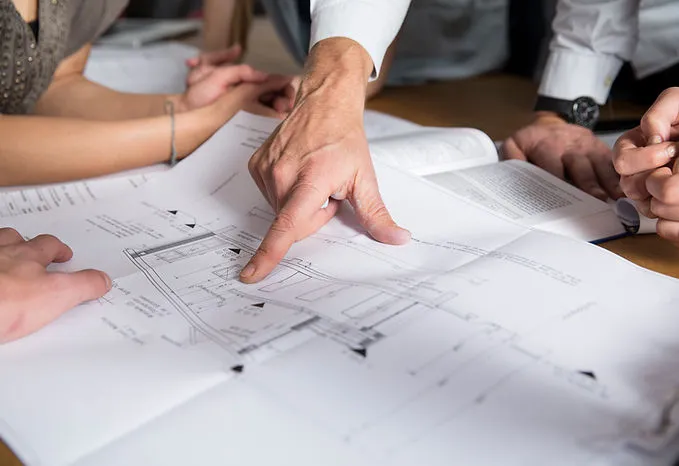 Land planning professionals reviewing drawings